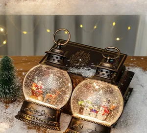 Detail of vintage Christmas lanterns with Santa and snowman scenes inside glowing globes