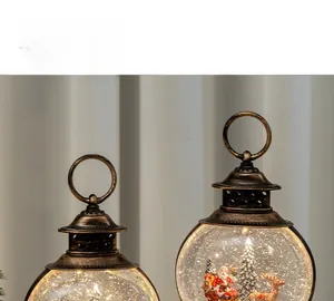 Close-up of vintage bronze Christmas lanterns with glowing Santa Claus snow globe scenes