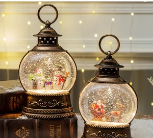 Close-up of vintage bronze Christmas lanterns with Santa and snowman scenes inside