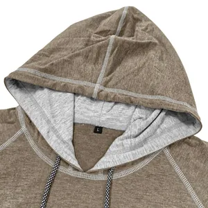 Detail of hooded short sleeve t-shirt featuring dual-color hood and contrast topstitching