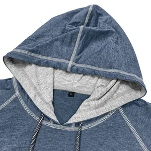 Close-up of hooded neckline with gray lining, adjustable drawstring, and size L label
