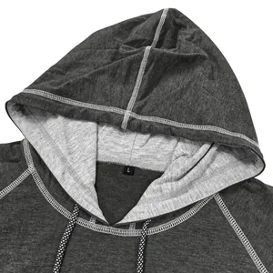 Detail of hooded t-shirt with grey knit texture, contrast lining and braided drawstring