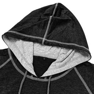 Detail of grey hooded t-shirt with black and white drawstrings and knit texture