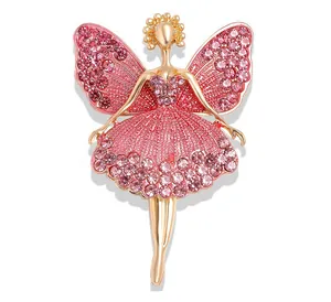 Detail of pink crystal encrusted ballerina brooch with elegant gold plating finish