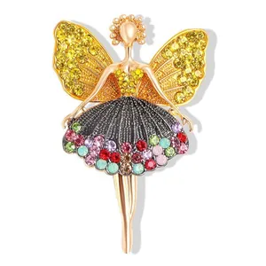 Golden ballet dancer brooch featuring vibrant multicolored rhinestones on a white background