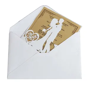 Laser cut white wedding invitation set with Mr & Mrs silhouette and kraft insert