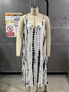 Detail shot of a black and white tie-dye maxi dress with spaghetti straps on a mannequin