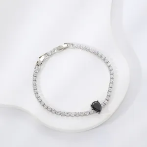 Elegant silver bracelet with white zircon pave and a black pear-shaped teardrop gemstone