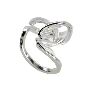 Modern silver-finish swan wing ear cuff with polished and matte textures