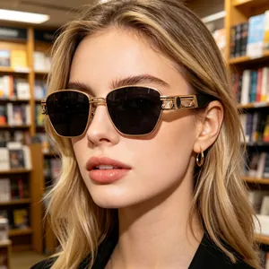 Detailed view of gold steampunk sunglasses featuring intricate Greek fret temple patterns