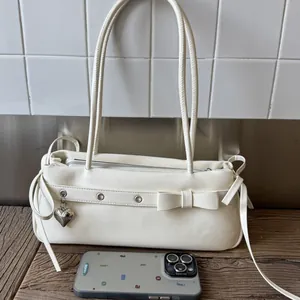 Women Y2K PU Leather Baguette Bag With Heart Pendant Bow Decor Underarm Shoulder Bag For Commuting Daily Fashion Handbag