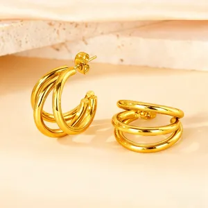Polished gold multi-layer C-shaped hoop earrings featuring a minimalist concentric design