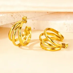 Chic multi-layered C-shape gold hoop earrings with polished metallic finish for women