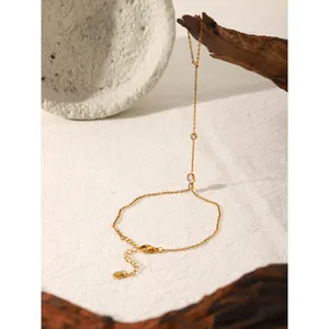 Elegant gold finger bracelet with zircon accents featuring an adjustable lobster clasp closure