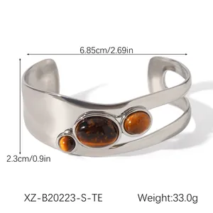 Brazalete abierto retro de acero inoxidable con tres piedras de ojo de tigre