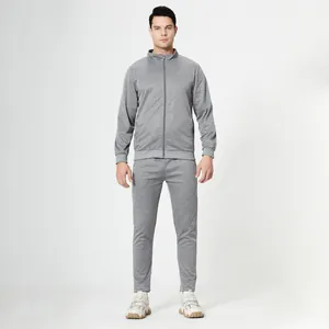 Detail view of men's two-piece tracksuit in heather grey with full-zip jacket and joggers