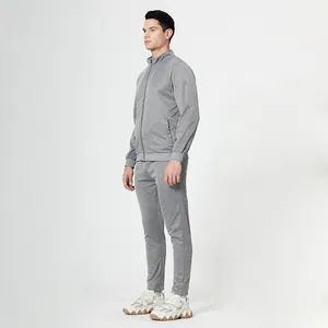 Detailed side profile of light gray men's slim-fit sporty jacket and matching trousers set