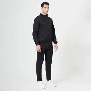 Detailed full-body view of men's black athletic tracksuit featuring zip-up jacket and pants