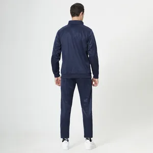 Back view of a men's navy blue track suit set with ribbed cuffs and stand collar jacket