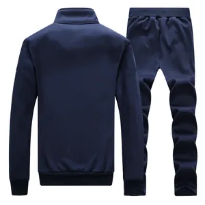 Rear view of navy blue men's knitted tracksuit showing ribbed cuffs and elastic waistband