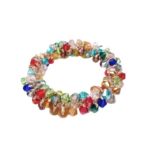 Bunter Kristall-Haargummi und Armband mit funkelnden Steinen und goldenem Gummiband