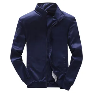 Detailed view of navy blue zip-up sports jacket with ribbed cuffs and stand collar