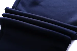 Close-up of navy blue knitted fabric texture for men's casual two-piece tracksuit set