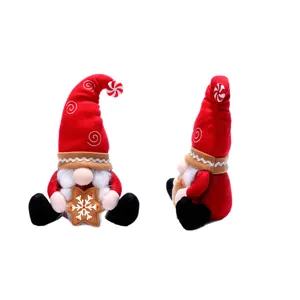 Christmas gnome plush with red knit hat and gingerbread star from two different angles
