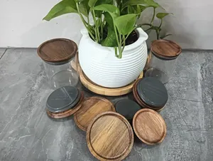 Detail view of acacia wood Mason jar lids with grey silicone sealing rings for storage