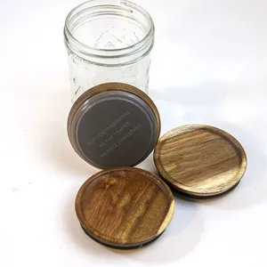 Acacia wood Mason jar lids with silicone rings for storage and glass jar organization