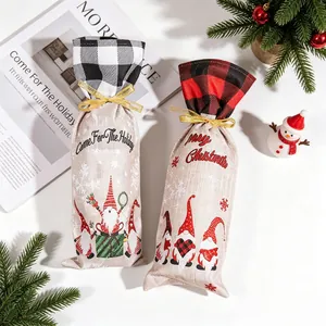 Close-up of linen Christmas wine bottle bags featuring gnome prints and plaid details