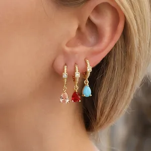 Luxury 18K gold plated drop earrings set with colorful zircon stones on female model