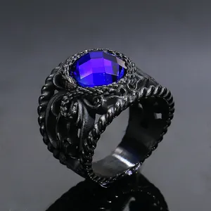 Detailed close-up of retro gothic titanium steel ring with large blue gemstone