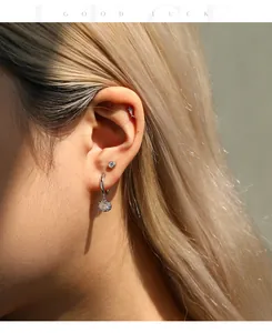 Detailed view of D color moissanite ear studs and S925 sterling silver hoop earrings