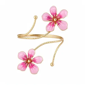 Elegant vintage gold metal armlet with pink enamel flower design for stylish women