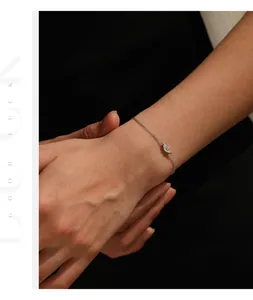 Detailed macro view of an elegant marquise-cut moissanite silver bracelet on a wrist