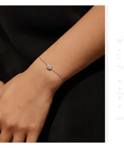 Detailed view of an elegant sparkling moissanite S925 silver bracelet on a woman's wrist