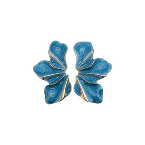 Elegant vintage blue enamel flower stud earrings with sophisticated gold-plated edges