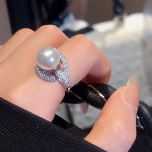 Detailed view of elegant 18k gold plated ring featuring a large white pearl and pavé zircons