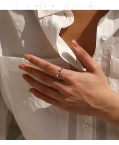 Close-up of moissanite S925 sterling silver elastic ring worn on a model's finger