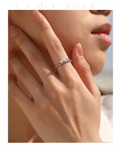 Close-up detail of a shimmering S925 sterling silver moissanite elastic stacking ring