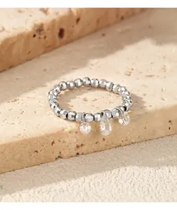 Detailed view of S925 sterling silver beaded elastic ring featuring three moissanite teardrop charms