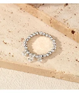 Close-up of S925 sterling silver beaded elastic ring with moissanite charms