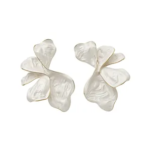 Elegant white enamel flower petal stud earrings with gold-toned edges on white background