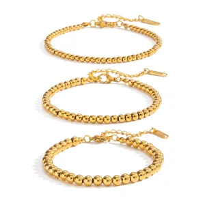 Three-piece set of minimalist 18K gold plated stainless steel bead bracelets in varying sizes