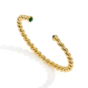 Elegant 18K gold-plated stainless steel twisted cable bangle with green stones
