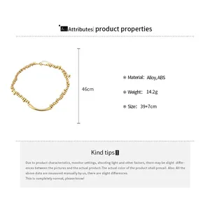 Gedetailleerde specificaties van onregelmatige gouden kralenketting met metalen staaf.