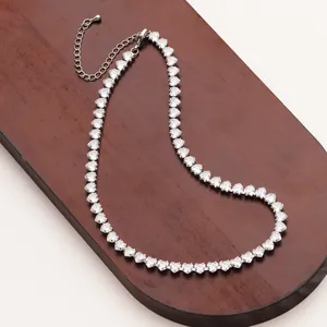 Detail of silver heart-shaped tennis necklace with crystal zircon and lobster clasp