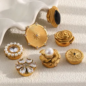 Detailed view of vintage 18K gold plated stainless steel cufflinks with faux pearls