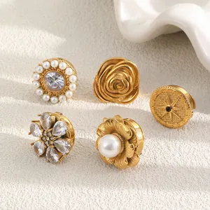Detailed macro view of 18K gold-plated vintage cufflinks with pearls and crystals